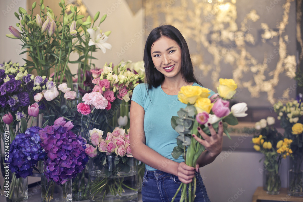 Happy woman selling flowers