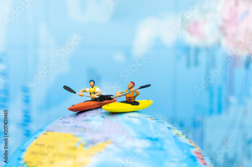 Miniature people : Traveler boating, kayaking in the ocean. Image use for Sports and Tourism concept. © polymanu