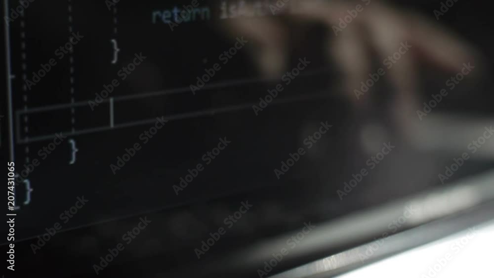 Reflection in the computer monitor of fingers typing on the keyboard Reflection in the computer monitor of fingers typing on the keyboard