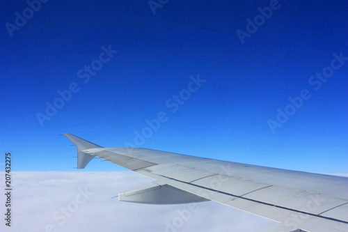 Wing of an airplane in the sky