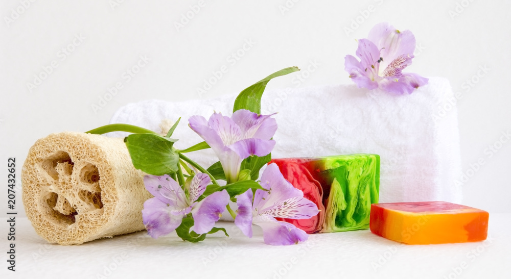 bathroom accessories, luff, alstroemeria flower, handmade soap and white towel bathroom accessories, luff, alstroemeria flower, handmade soap and white towel