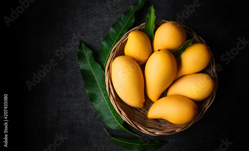 Yellow Mango Beautiful skin In the basket Blackboard background