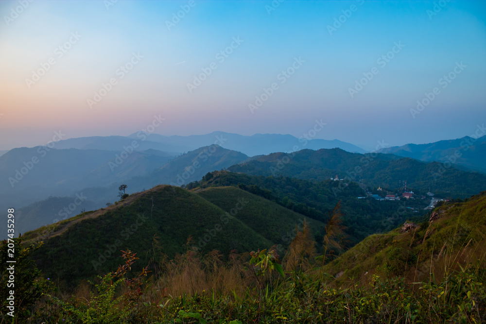 Light sunset behind the mountains Nern Chang Suek  hills, Kanchanaburi, Thailand