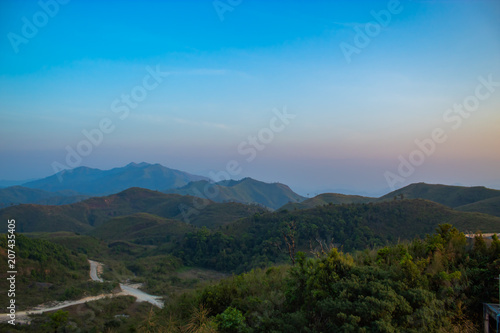 Light sunset behind the mountains Nern Chang Suek hills, Kanchanaburi, Thailand