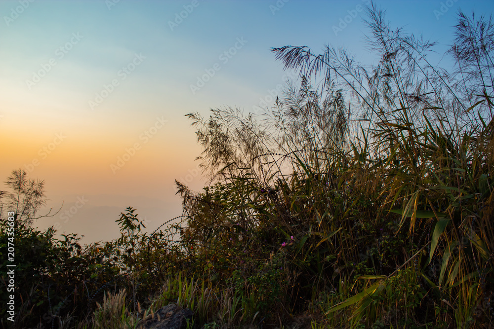 Light sunset behind the mountains Nern Chang Suek  hills, Kanchanaburi, Thailand