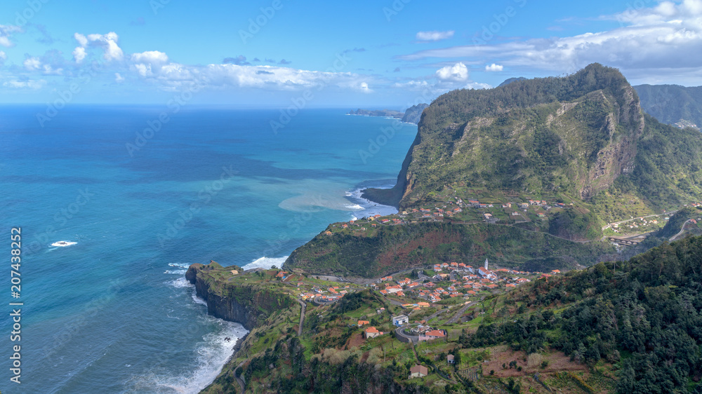 Eagle rock (Penha de Águia) and Faial small parish. Madeira Island, Portugal. Year 2018.