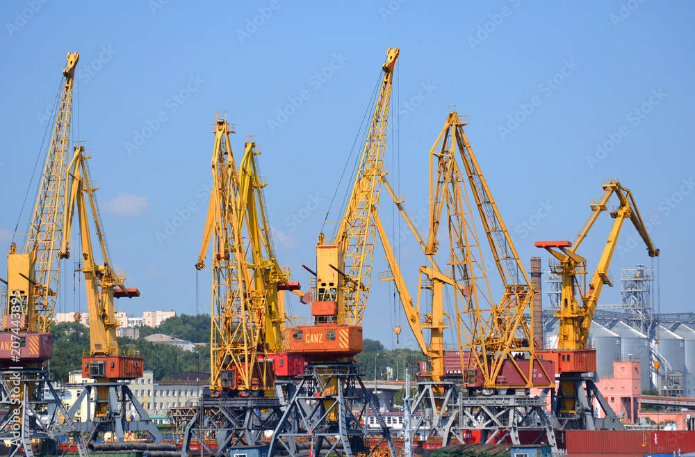 yellow cranes for lifting cargo at the sea port. City Odessa, Ukraine 18 July 2013 yellow cranes for lifting cargo at the sea port. City Odessa, Ukraine 18 July 2013