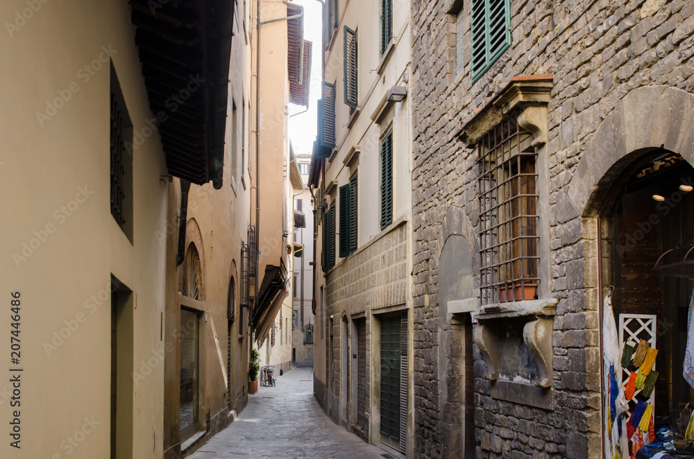 A traditional thin side street in Florence, Italy