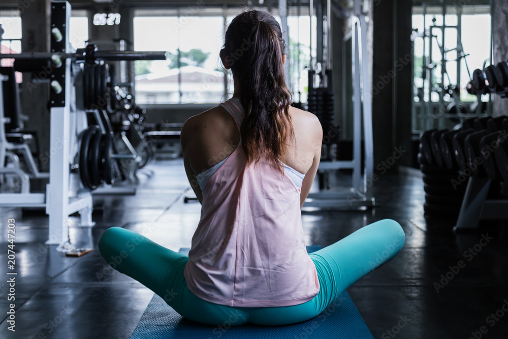 attractive woman exercise schedule time in gym workout with yoga lesson attractive woman exercise schedule time in gym workout with yoga lesson