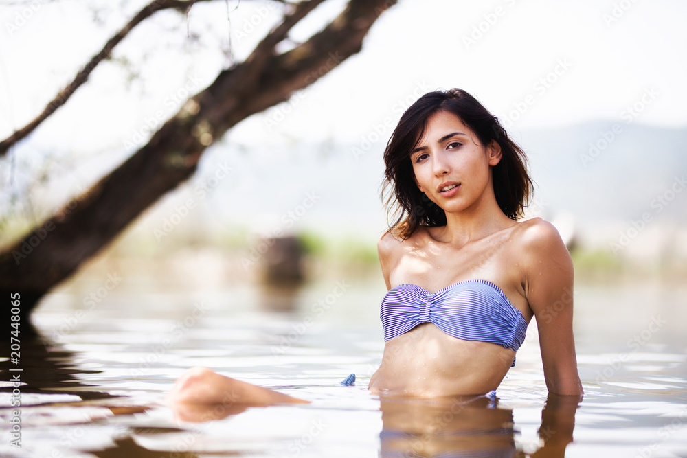 girl in water near a beach girl in water near a beach