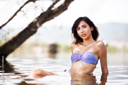 girl in water near a beach