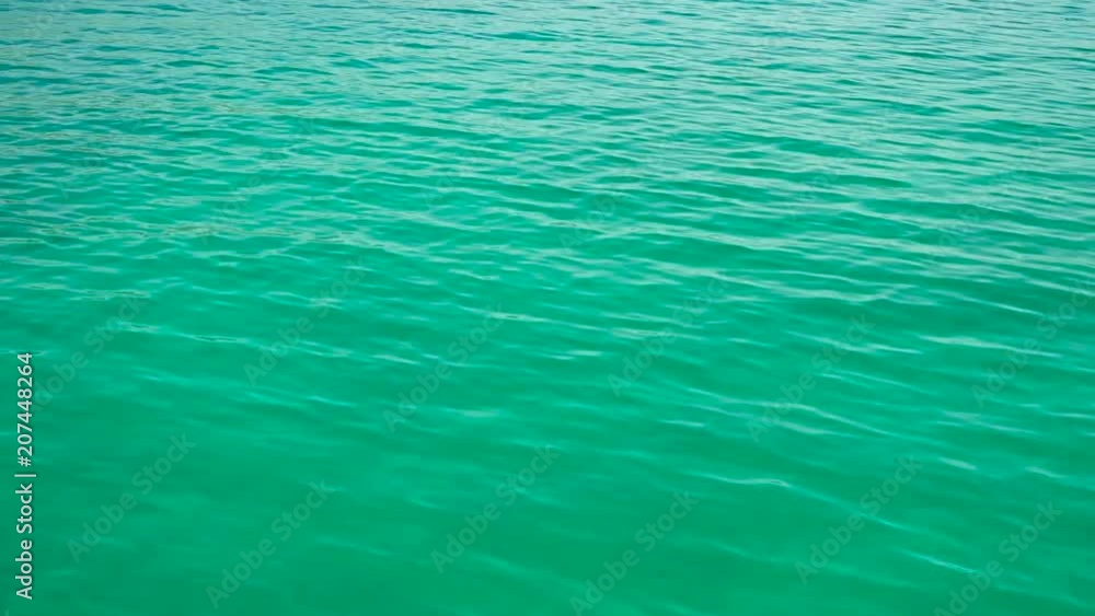 Water ripples on the surface of azure water Water ripples on the surface of azure water