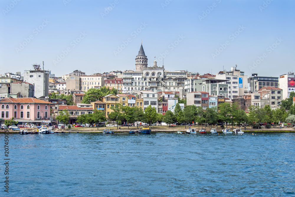 Istanbul, Turkey, 12 June 2007: The Galata Tower and ships in the Karakoy district of Istanbul.