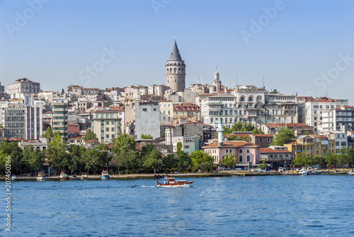 Istanbul, Turkey, 12 June 2007: The Galata Tower and ship in the Karakoy district of Istanbul. © Kayihan