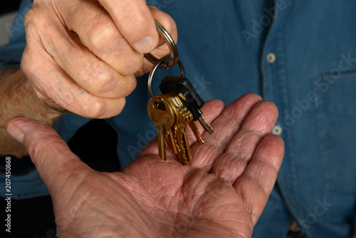 Senior handing Over Car Keys photo