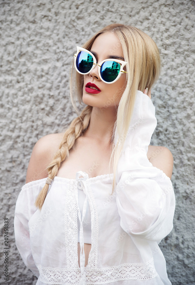 Young blonde woman wearing sunglasses Young blonde woman wearing sunglasses