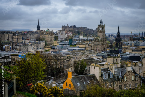 Edinburgh City and Castle, Scotland, viewed from Calton Hill on a cloudy afternoon, Scott monument and Balmoral clock tower in background.