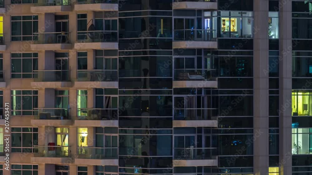 Glowing windows of skyscrapers at evening timelapse Glowing windows of skyscrapers at evening timelapse