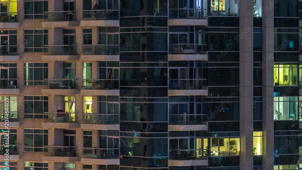 Glowing windows of skyscrapers at evening timelapse Glowing windows of skyscrapers at evening timelapse