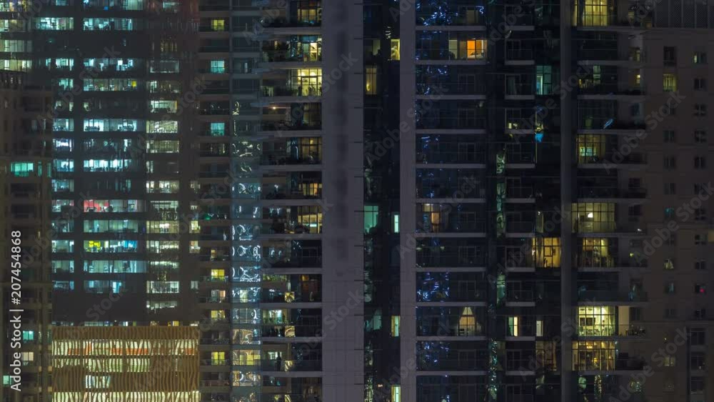 Glowing windows of skyscrapers at evening timelapse Glowing windows of skyscrapers at evening timelapse