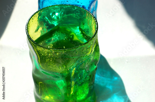 Two glasses of colored glass. Refreshing drink.