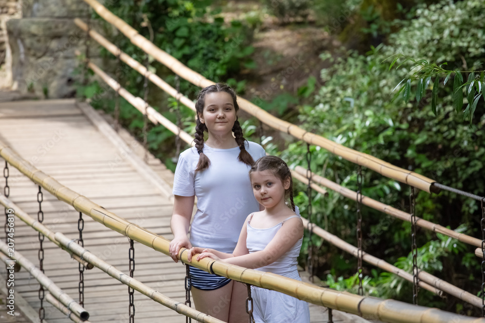 two girls on the suspension bridge