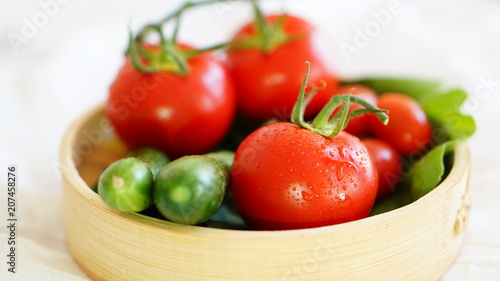 fresh organic vegetable. Tomatoes, cherry tomatoes, cucumber with white background