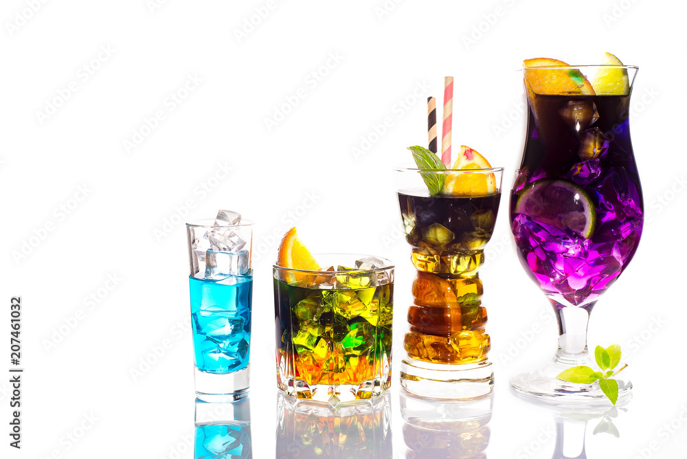 Selection of colorful festive drinks, alcoholic beverages and cocktails in elegant glasses on white