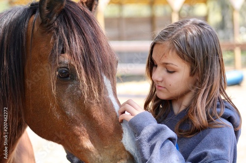 Girl Petting Horse's Face © Kimberley