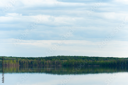 beautiful  picturesque nature. The lake is surrounded by forest.