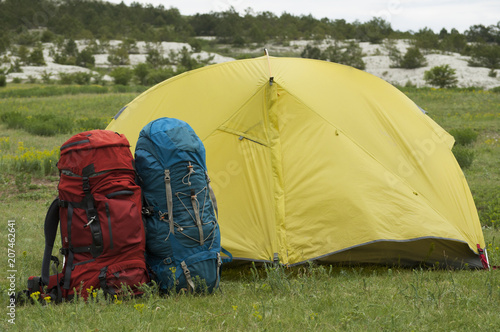Wallpaper Mural Two tourist backpacks near the assault tent in a mountainous area Torontodigital.ca