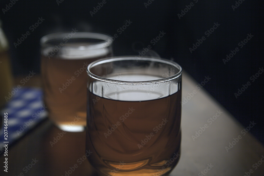 Cups of tea on the grunge background. Hot Tea in glass cup Cups of tea on the grunge background. Hot Tea in glass cup