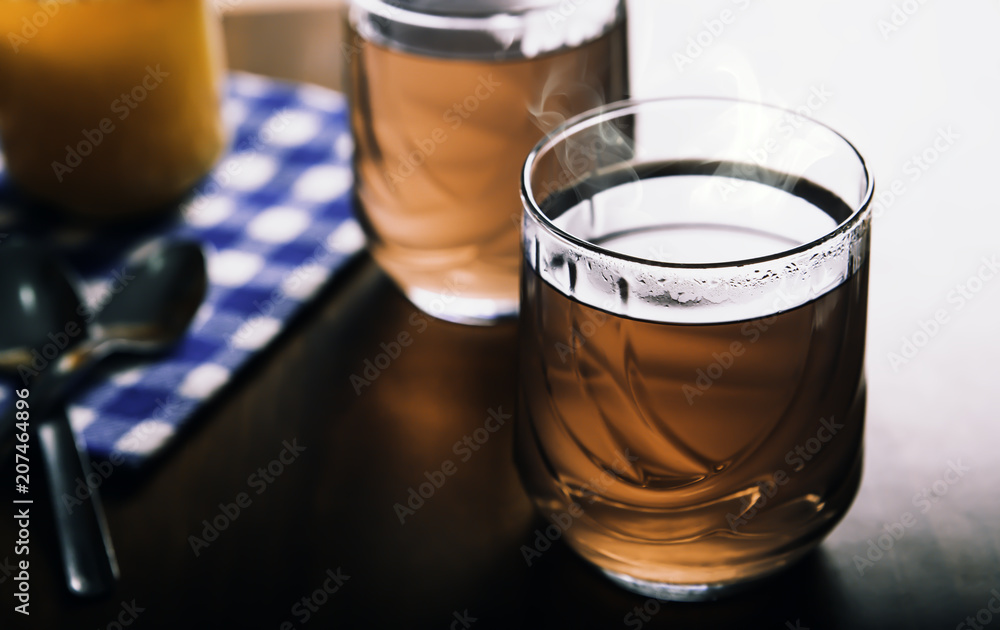 Cups of tea on the grunge background. Hot Tea in glass cup Cups of tea on the grunge background. Hot Tea in glass cup