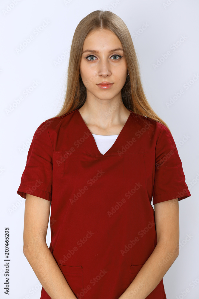 Smiling young nurse or surgeon portrait isolated over white background. Smiling young nurse or surgeon portrait isolated over white background.