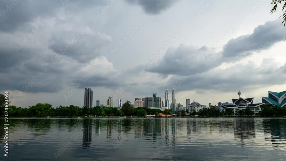 4K Time lapse of moving clouds over downtown Kuala Lumpur, Malaysia. Zoom In. 4K Time lapse of moving clouds over downtown Kuala Lumpur, Malaysia. Zoom In.