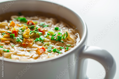 noodle soup in bowl. asian vegetable noudle soup. Vegetable soup on white background. photo