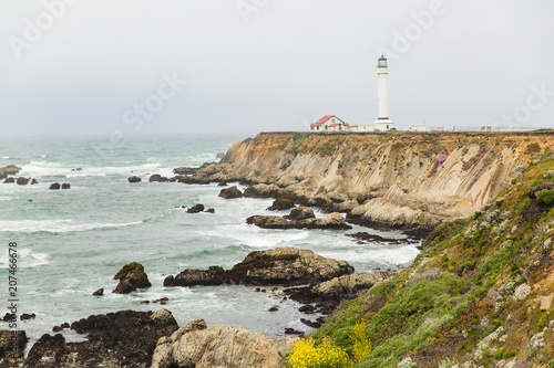 Point Arena lighthouse perched on rocky cliff in Mendocino, California