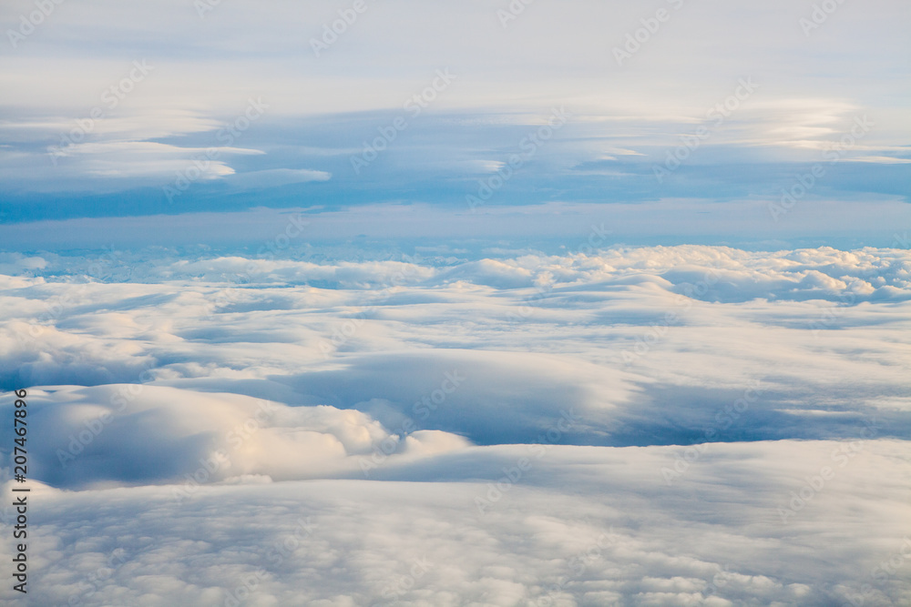 The white clouds background and texture. Cloud in the sky. Cloudscape with Sky and Clouds Background The white clouds background and texture. Cloud in the sky. Cloudscape with Sky and Clouds Background