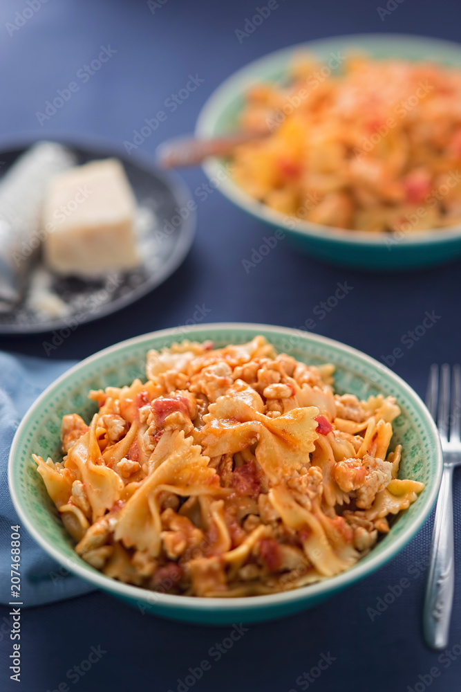 Farfalle pasta with chicken in tomato sauce Farfalle pasta with chicken in tomato sauce