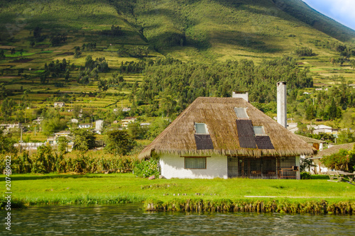 Outdoor view of typical house in Imbabura in the lakeshore of the Lake San Pablo in northern Ecuador photo