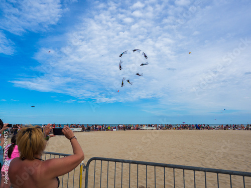 Performance of four-wire acrobatic kites revolution by the sea on the occasion of the international kite festival.