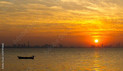 Sunset in the sea on silhouette background