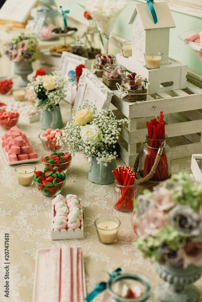 candy bar at a wedding filled with sweets and baubles