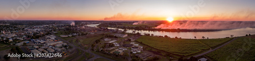 Bundaberg, Queensland / Australia - August 2016 - Aerial Panorama of a Blood Red Sunset overlooking the Burnett River photo