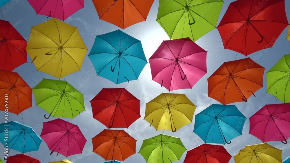 Colorful umbrellas hanging in the sky Colorful umbrellas hanging in the sky
