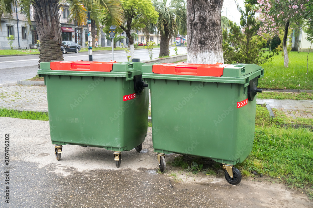 Big green recycling containers on the street Big green recycling containers on the street