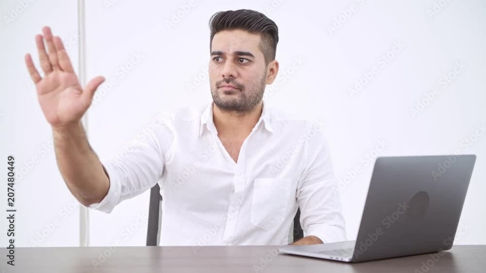 Business man using laptop. Indian man pressing button, panning, for HUD VFX overlay. Business man using laptop. Indian man pressing button, panning, for HUD VFX overlay.