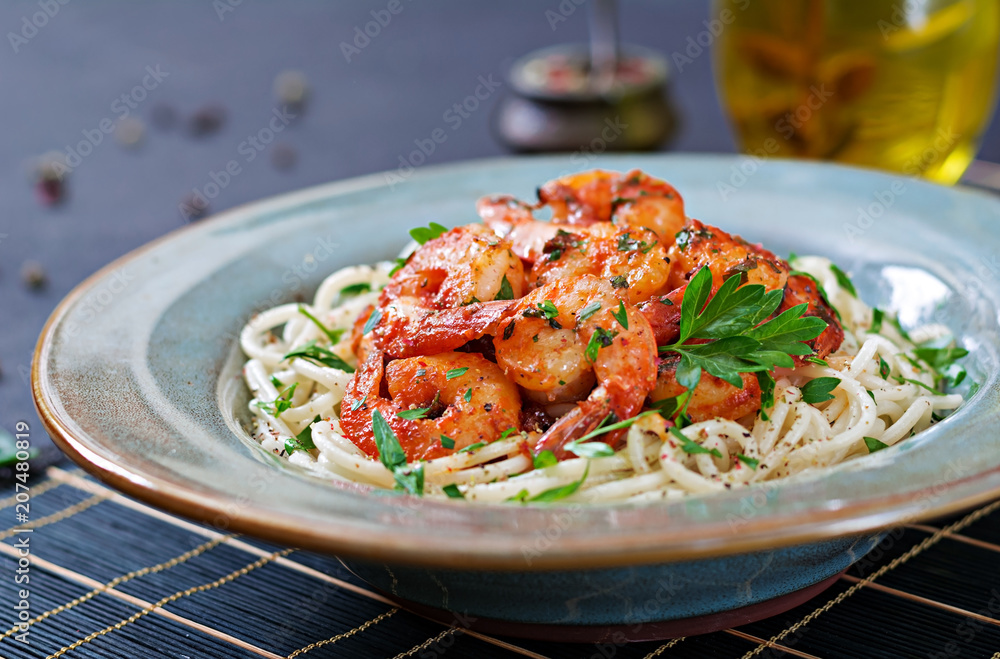 Pasta spaghetti with shrimps, tomato and chopped parsley. Healthy food. Italian meal. Pasta spaghetti with shrimps, tomato and chopped parsley. Healthy food. Italian meal.