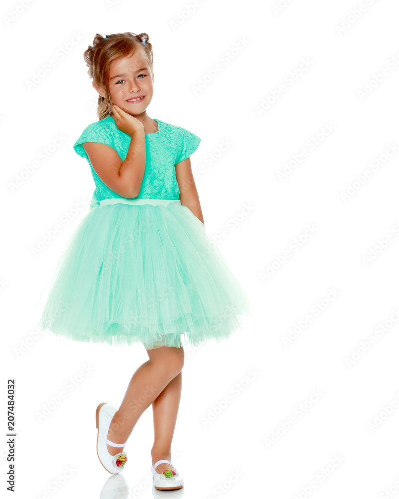 Fashionable little girl in a dress