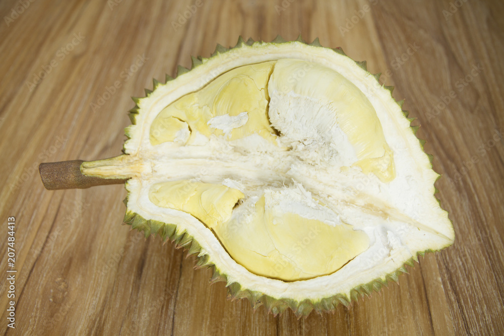 Ripe durian on wooden background Ripe durian on wooden background